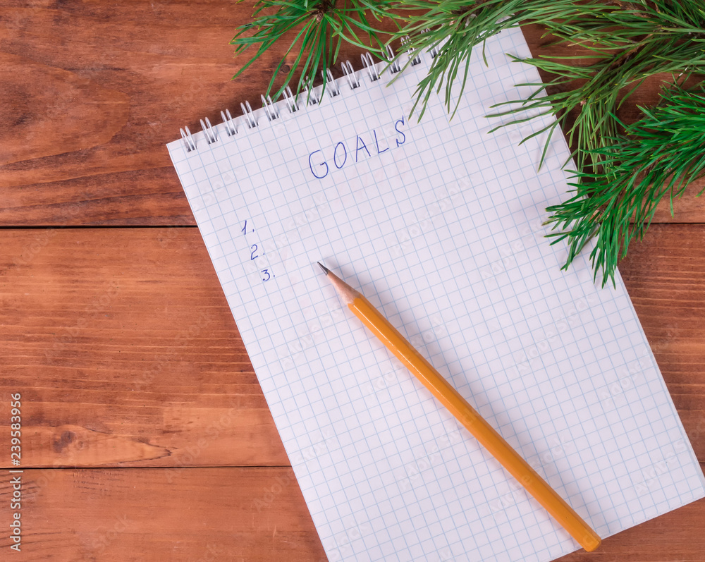 goals for new year in blank open notebook goals for new year in blank open notebook