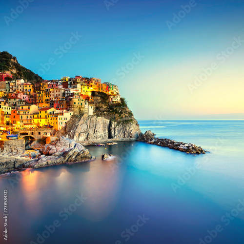 Manarola village, rocks and sea. Cinque Terre, Italy. Long Exposure.