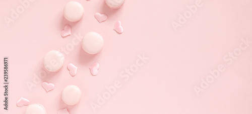 Elegant composition for Valentine's Day. Pink hearts, macaroon on pastel pink background. Valentine day concept, design. Flat lay, top view, copy space, banner © prime1001
