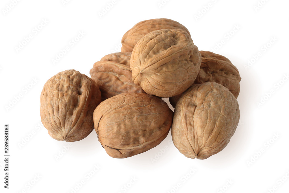 Heap of walnuts isolated on white