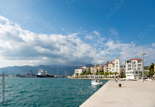 Beautiful romantic old town of Tivat with man in boat, Montenegro, Tivat