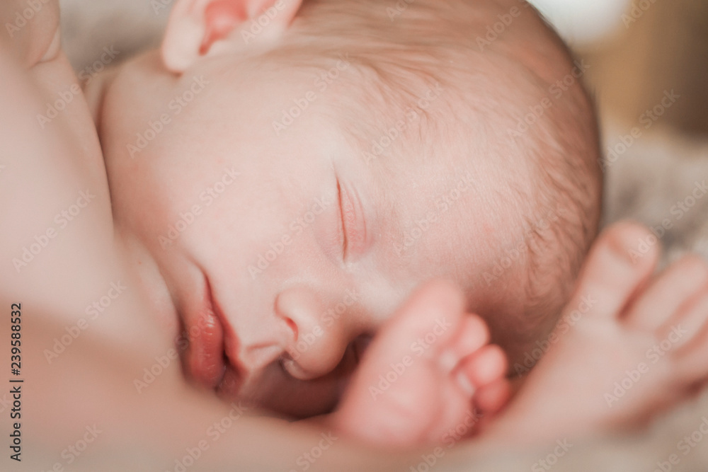Baby laying with feet close to face flexible Baby laying with feet close to face flexible