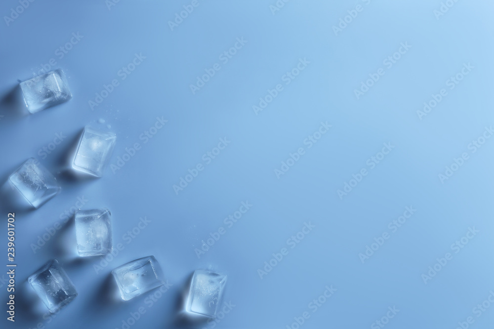 Ice cubes on color background, top view. Space for text Ice cubes on color background, top view. Space for text