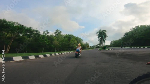 Wallpaper Mural Back view of man and woman riding away fast Torontodigital.ca