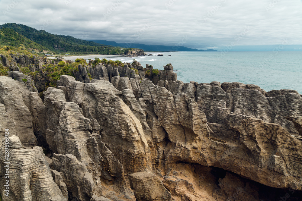 Cliffs in the ocean, world famous Pancake Rocks, West Coast of South Island New Zealand