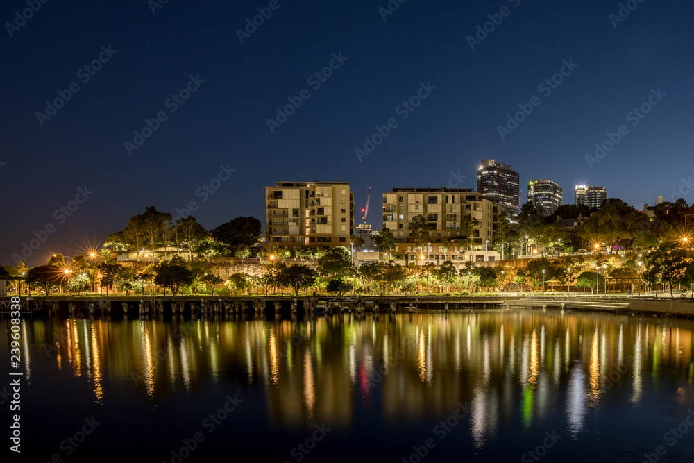 Apartments at night and reflection on the bay