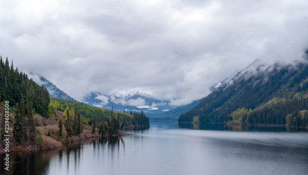 Mist over Cheakamus lake near whistler on a cloudy day - British Columbia, Canada