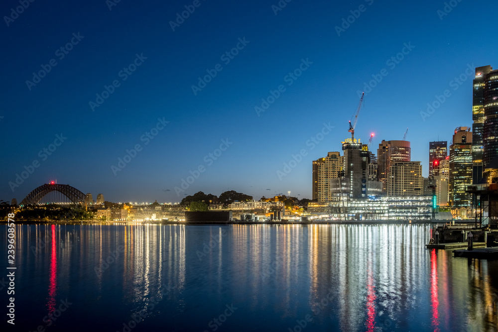 Dawn and lights reflecting onto Sydney Harbour
