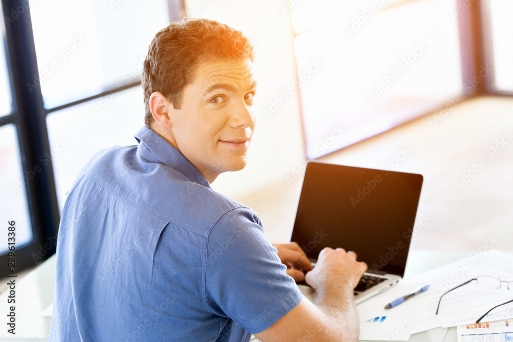 Handsome businessman working at computer Handsome businessman working at computer