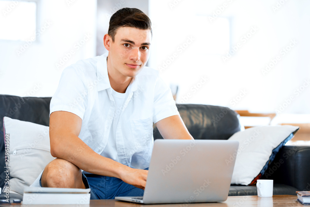 Man working on laptop at home Man working on laptop at home