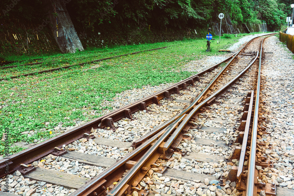 train tracks on gravel, two of railways or railroads tracks merge in a
