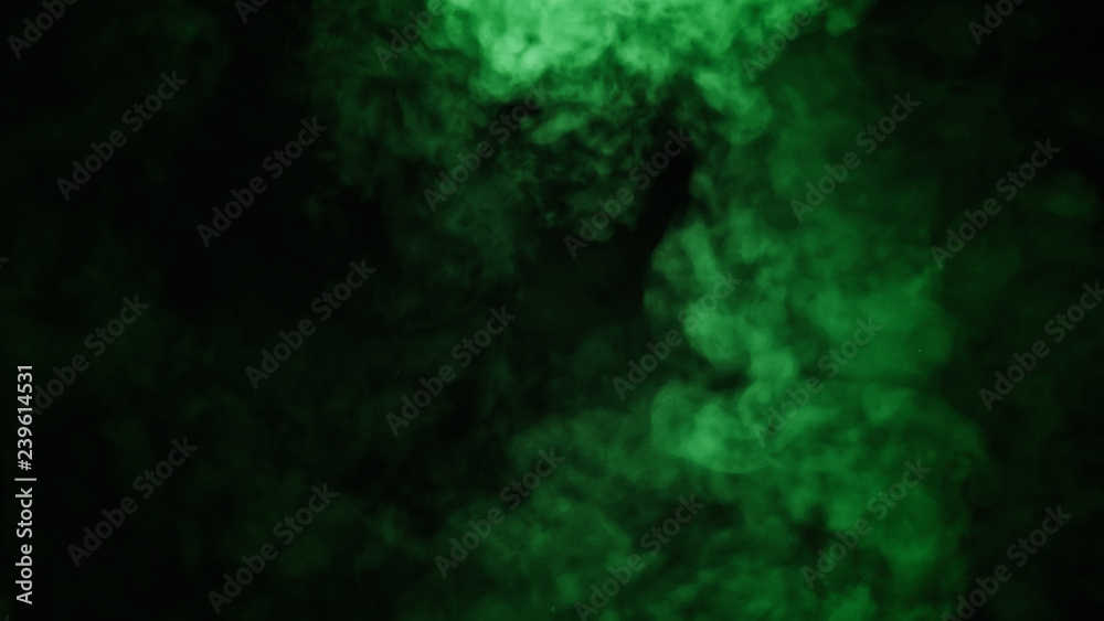 Abstract green smoke mist fog on a black background. Texture. Design element.