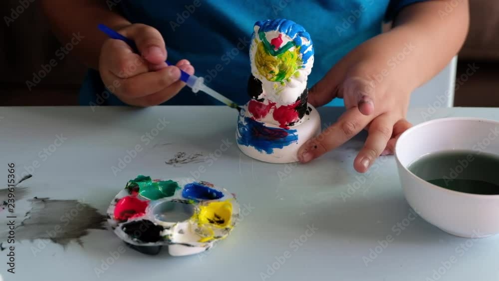 4k Video Children Are Coloring Plaster Dolls