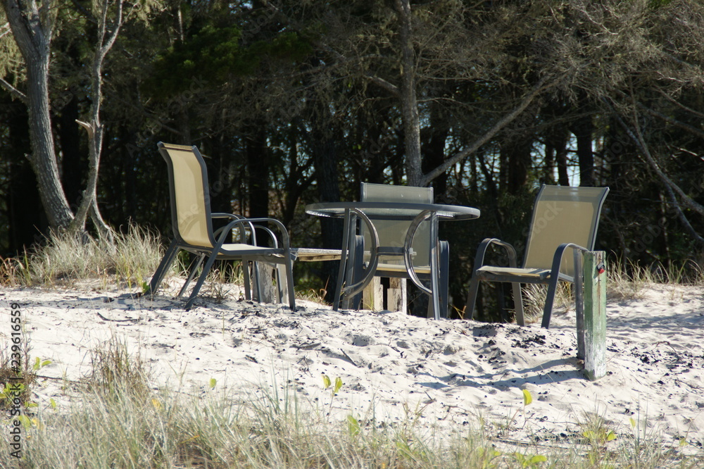 table and chairs on beach