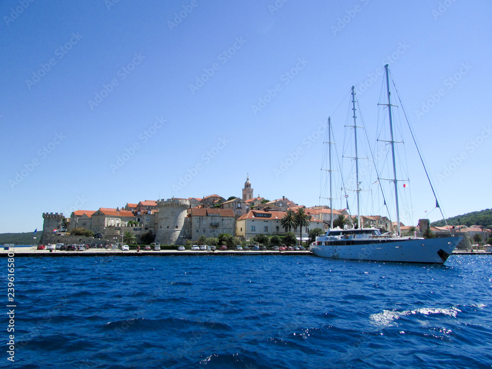 Amazing view to Korcula old town with the big beautiful sailing ship