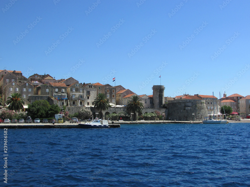 View to Korcula old town wall and towers from adriatic sea