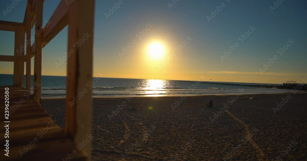 SUNRISE SOUTH BEACH 6 woman sitting on beach 3 SUNRISE SOUTH BEACH 6 woman sitting on beach 3