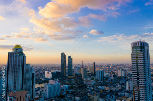 Evening scene in a aerial view of Bangkok buildings, which Bangkok city downtown with sunset sky mood