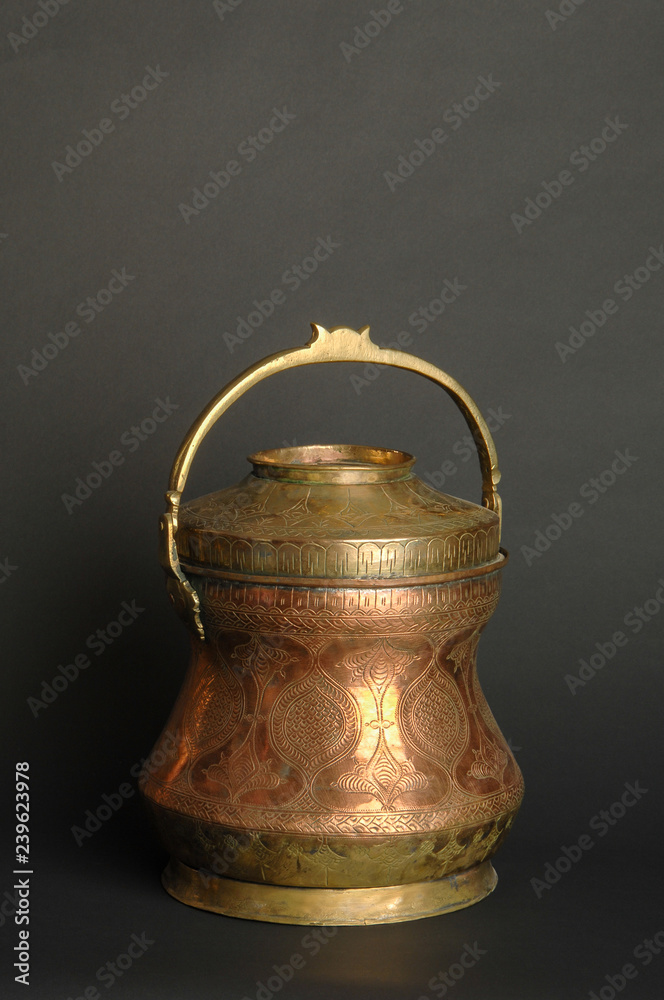 ancient metal bowl on dark background. antique bronze tableware ancient metal bowl on dark background. antique bronze tableware