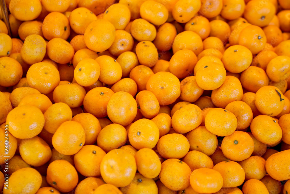 A heap of mandarins, tangerines or clementines at the farmers market