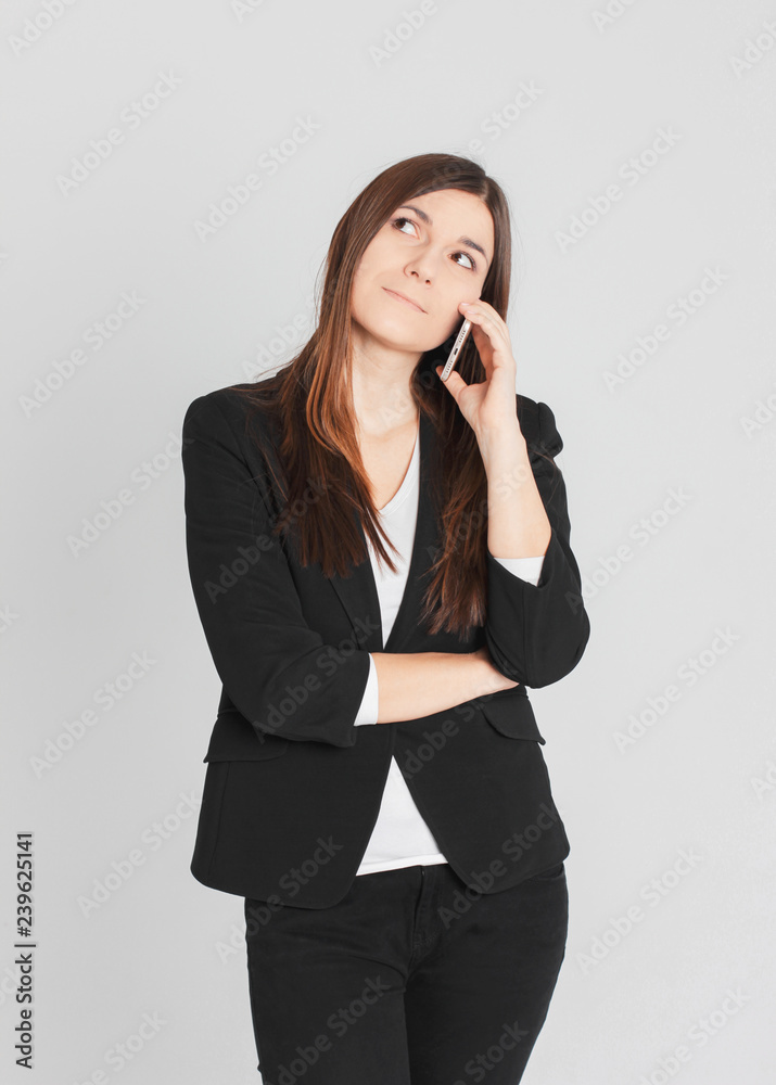 Portrait of young worried brunette woman lady talking on mobile Portrait of young worried brunette woman lady talking on mobile