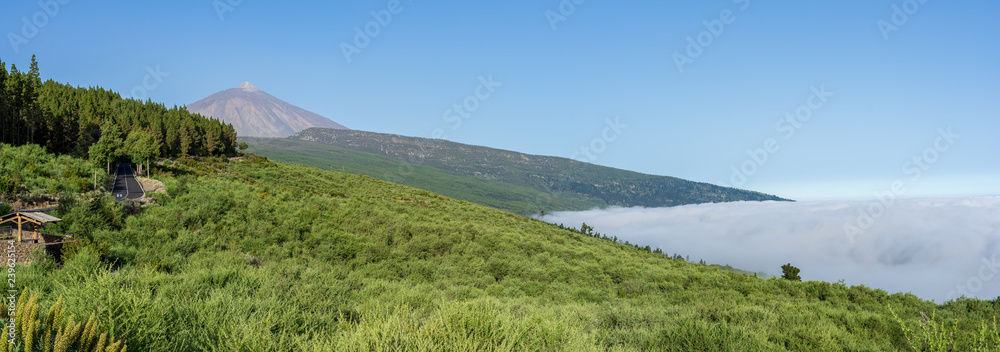 Panoramic view of the morning mountain valley. Volcano Teide in the background. Tenerife. Canary Islands. Spain. View from the viewpoint - Panoramic view of the morning mountain valley. Volcano Teide in the background. Tenerife. Canary Islands. Spain. View from the viewpoint -