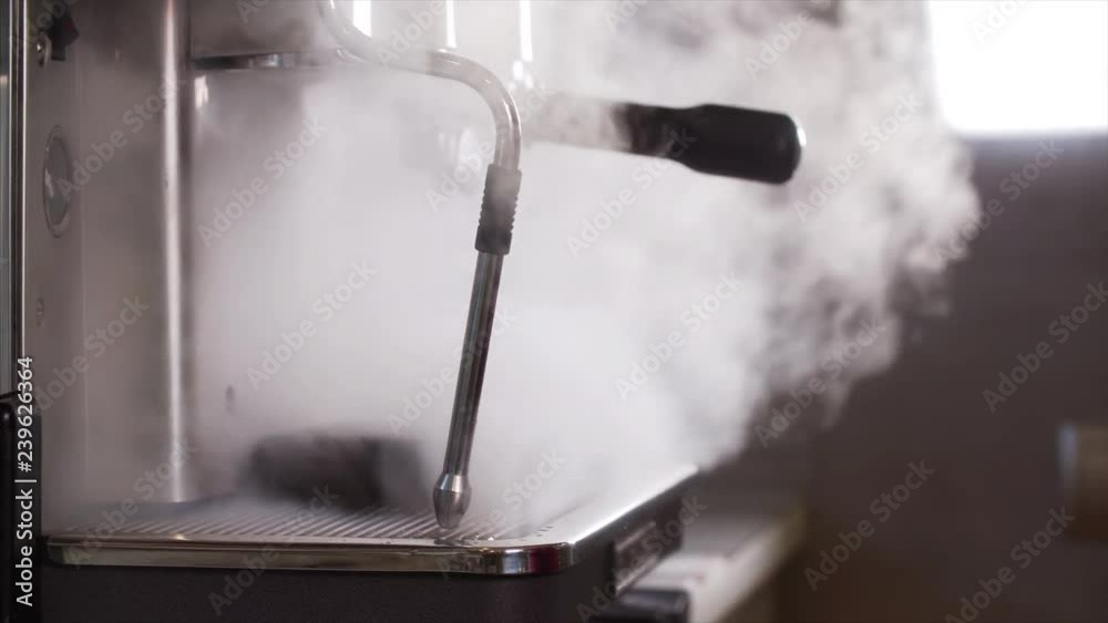 Sliding view of steam going from coffee machine in cafe Sliding view of steam going from coffee machine in cafe
