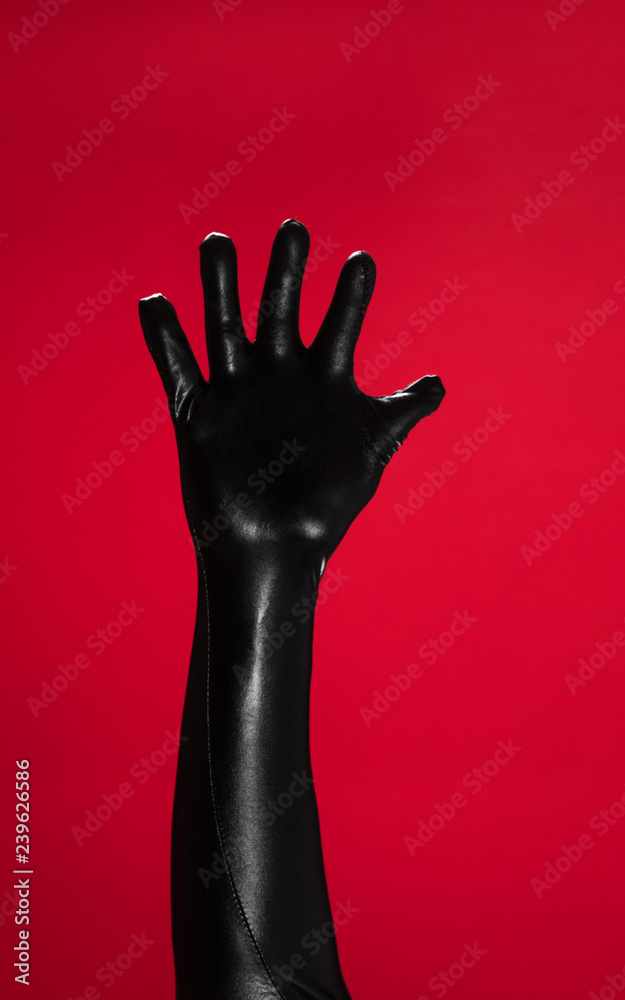 latex fetish hands on red background latex fetish hands on red background