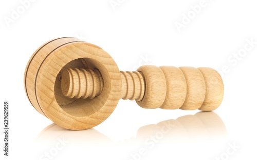 A wooden screw type nutcracker on a white background