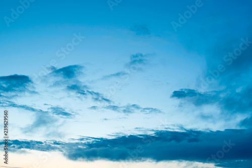 Cumulus clouds of the sunset with the sunset Blue sky blurred background defocusing