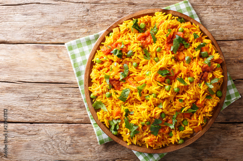 Indian food Tawa Pulao rice with vegetables and spices close-up. horizontal top view