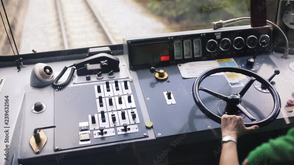 a narrow gauge tourist train driver controls the vehicle a narrow gauge tourist train driver controls the vehicle