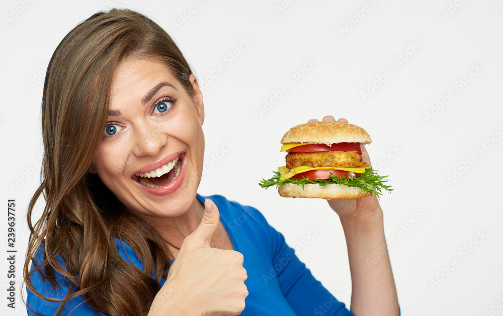girl holding burger doing thumb up.