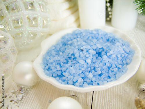 Colored sea salt, spa set surrounded by christmas decorations