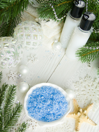 Colored sea salt, spa set surrounded by christmas decorations
