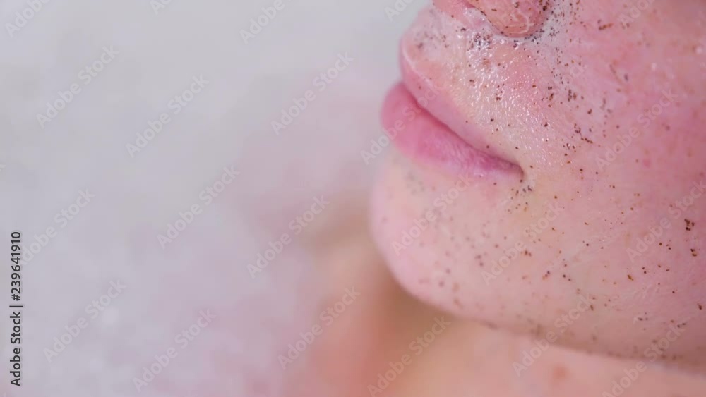 Scrub on woman's face. Lips close-up. Woman ia taking a bath. Scrub on woman's face. Lips close-up. Woman ia taking a bath.