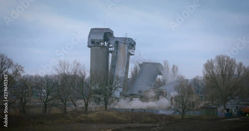 old concrete silo building demolition by an explosion