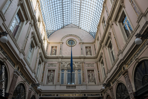 Architecture of Galeries Royales Saint Hubert in Brussels. It is an ensemble of shopping arcade and has a fascinating architecture that looks stunning. The name is also written in local language. photo