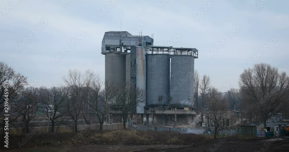 old concrete silo building demolition by an explosion