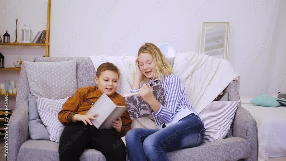 Boy and girl reading a book Boy and girl reading a book