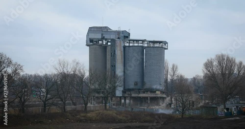 old concrete silo building demolition by an explosion