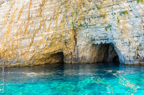 Greece, Zakynthos, White chalk cliff stone wall and keri caves with perfect turquoise water © Simon