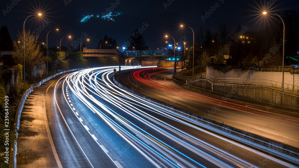 Long exposure at night, foggy view with lights and glitters of Cassiar Connector Tunnel on Highway 1 BC. Vancouver. Beautiful British Columbia, Canada.