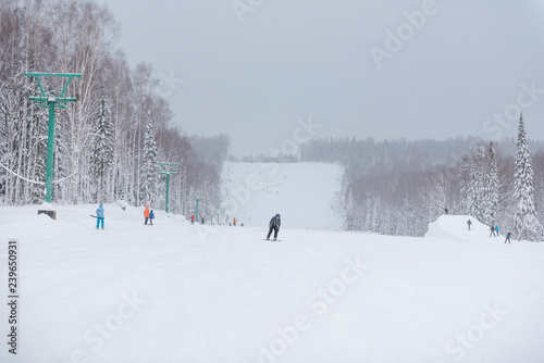 To ski in the winter from the mountain. Winter sports. Fun in the winter. The athlete is skiing.