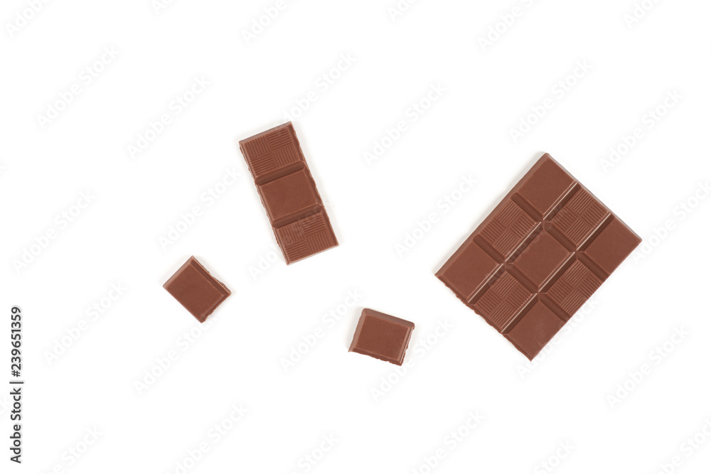 pieces of milk chocolate bar isolated on white background. pieces of milk chocolate bar isolated on white background.