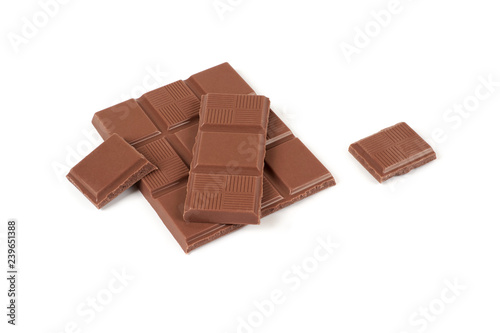 pieces of milk chocolate bar isolated on white background.
