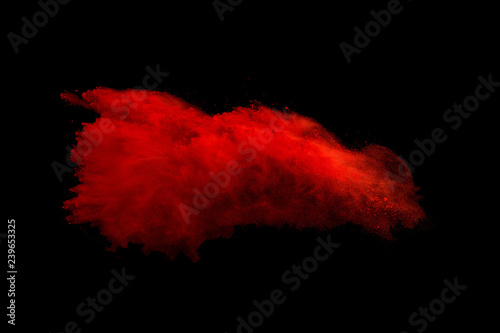 Explosion of colored powder on black background