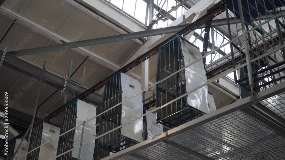 Manufacture of household appliances, shipping containers with household appliances moving on automated production line. Manufacture of household appliances, shipping containers with household appliances moving on automated production line.