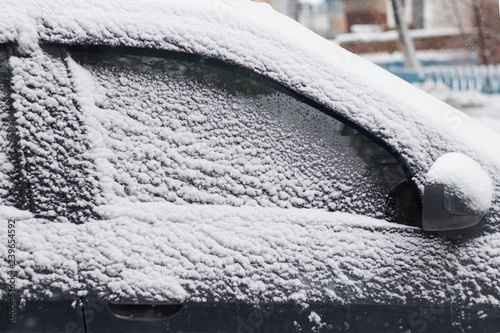 side windows of a car in the snow close up photo