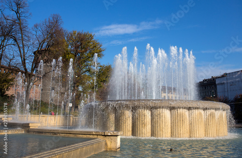 MILAN, ITALY, DECEMBER 5, 2018 - The fountain of Sforzesco Castle in Cairoli place, Milan, Italy photo